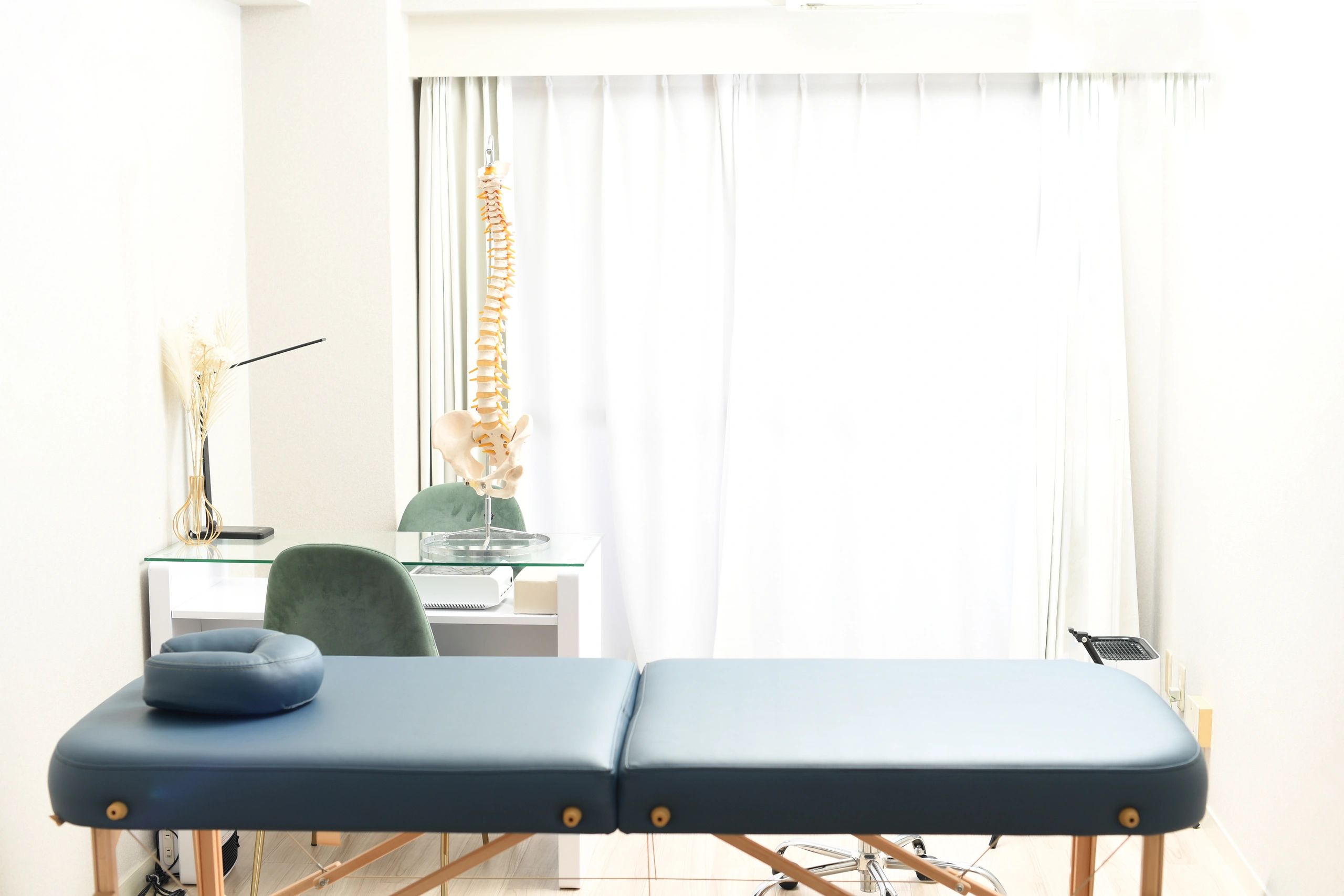 A room with a massage bed at an